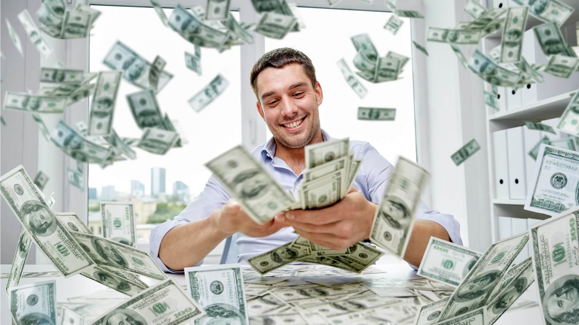 Man spreading dollar notes