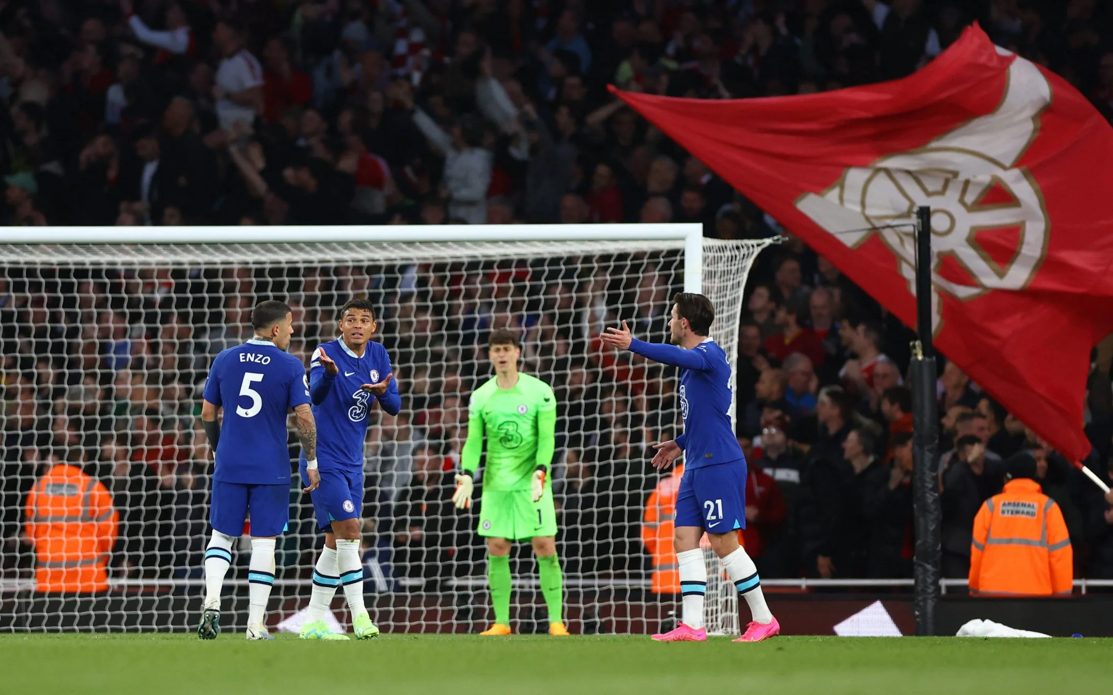 Chelsea players question one another during the league match against Arsenal at the Emirates