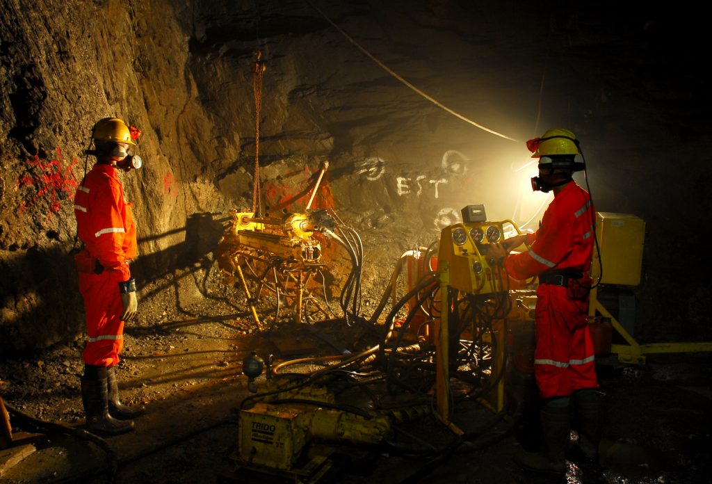 Miners underground a mine shaft