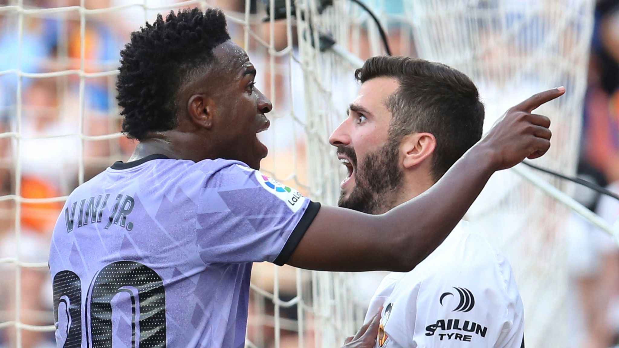 Vinicius Jr of Real Madrid (left) and Jose Luis Gaya of Valencia