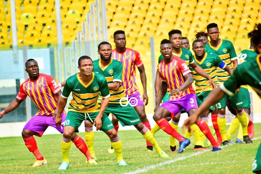Hearts of Oak and Aduana Stars players defend a set piece during the league match