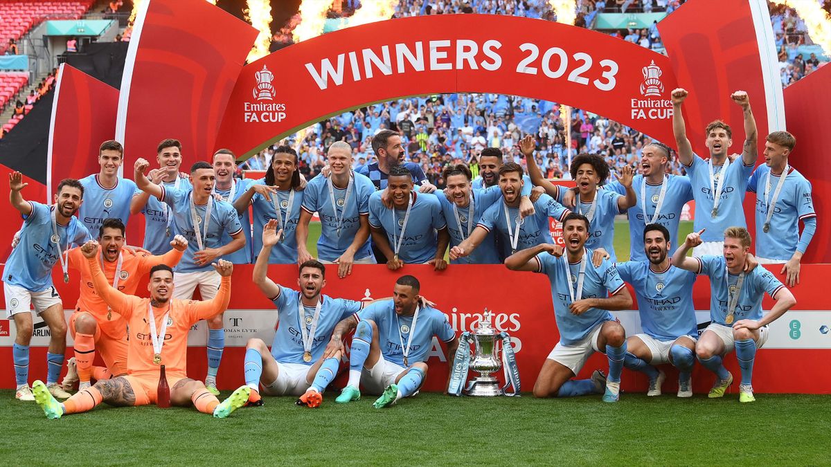 Manchester City celebrate after winning FA Cup final against Manchester United at Wembley Stadium, in London, on June 3, 2023