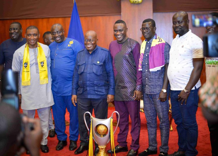 Officials of Medeama SC pose with President Akufo-Addo and the Ghana Premier League trophy