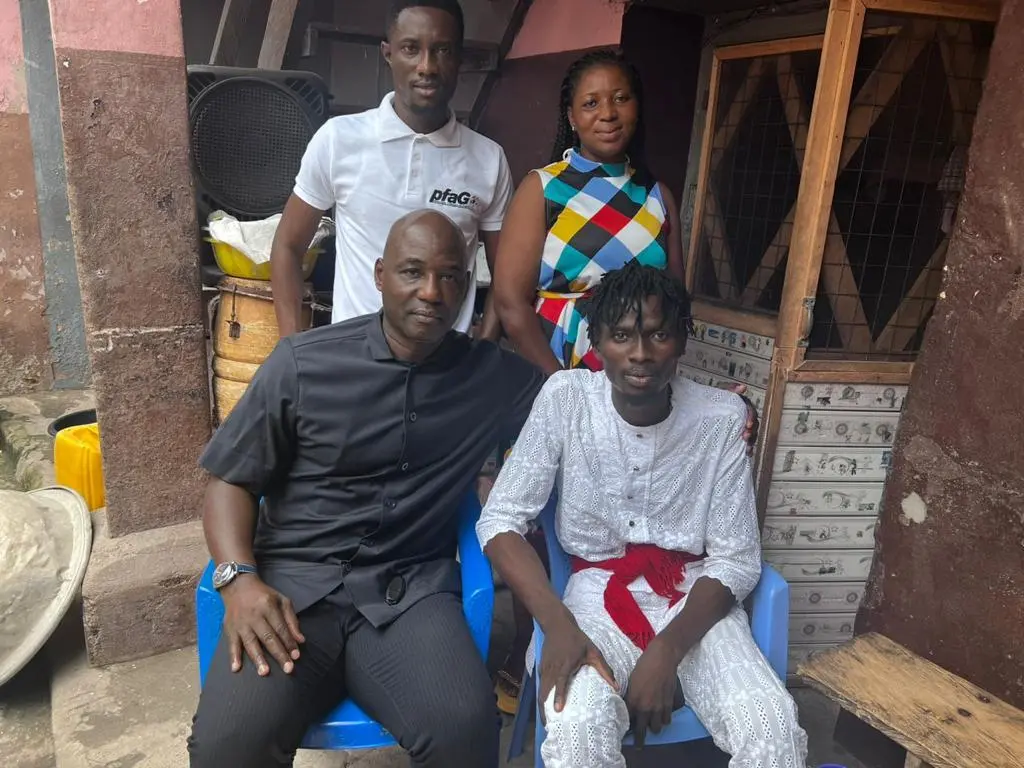 Anthony Baffoe (seated left), William Essu (seated right), Tetteh Zutah (PFAG Vice President) and a family member of Essu during the PFAG's visit to Essu