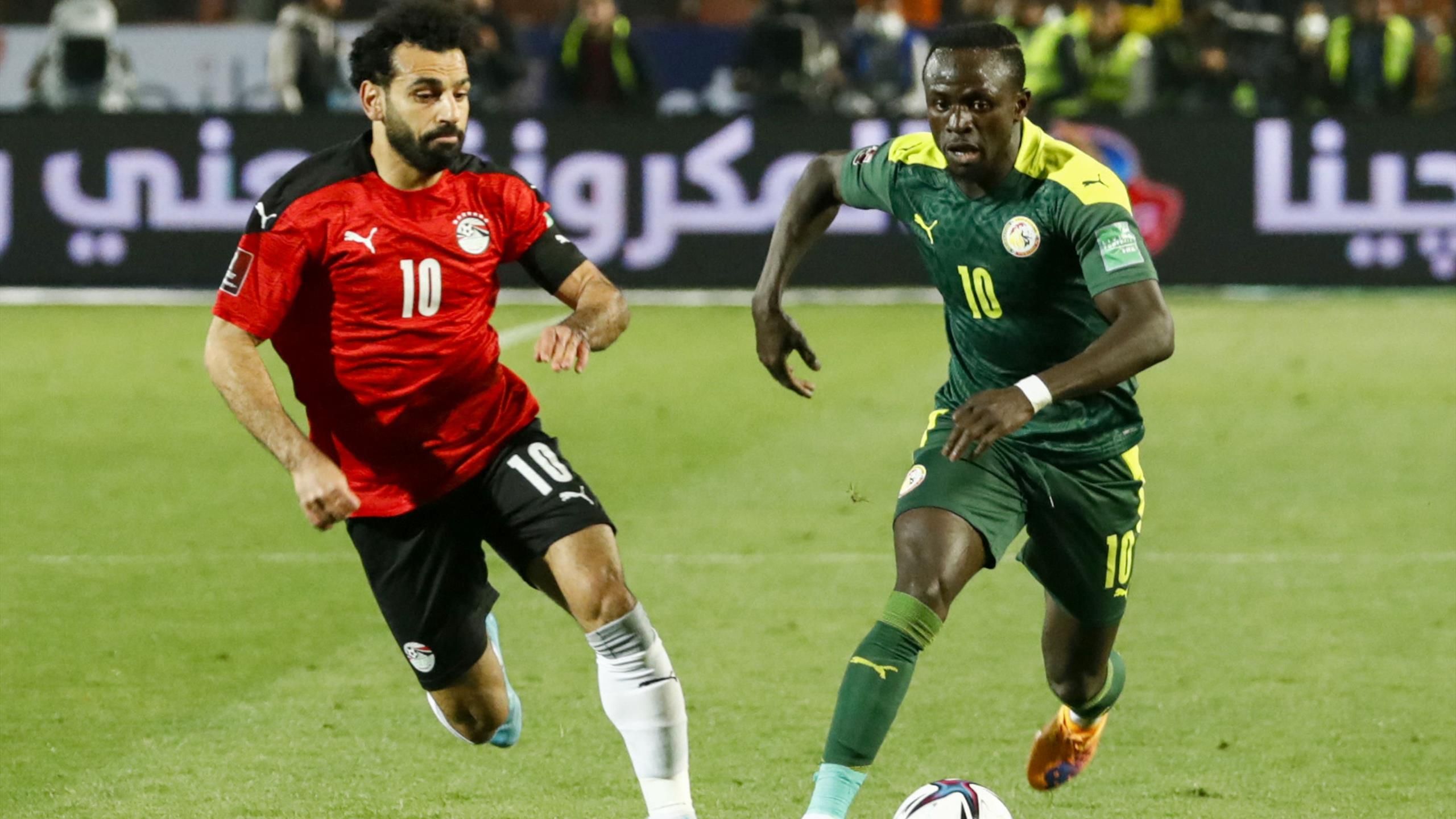 Mohammed Salah of Egypt and Sadio Mane of Egypt chase the ball in the AFCON 2021 final in Cameroon