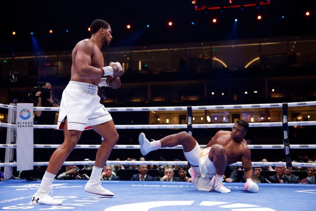 Anthony Joshua knocks down Francis Ngannou during their match up at the Kingdom Arena in Riydah, Saudi Arabia on March 8, 2024