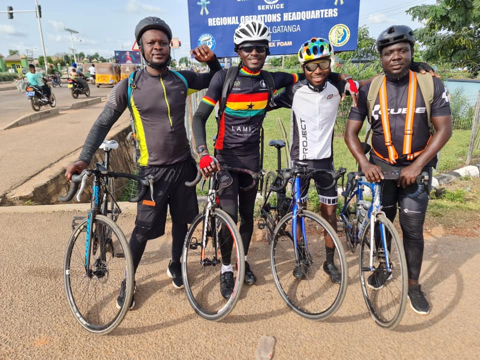 James with his colleagues at Keekee Cycling Connect pose for the cameras during one of their expeditions